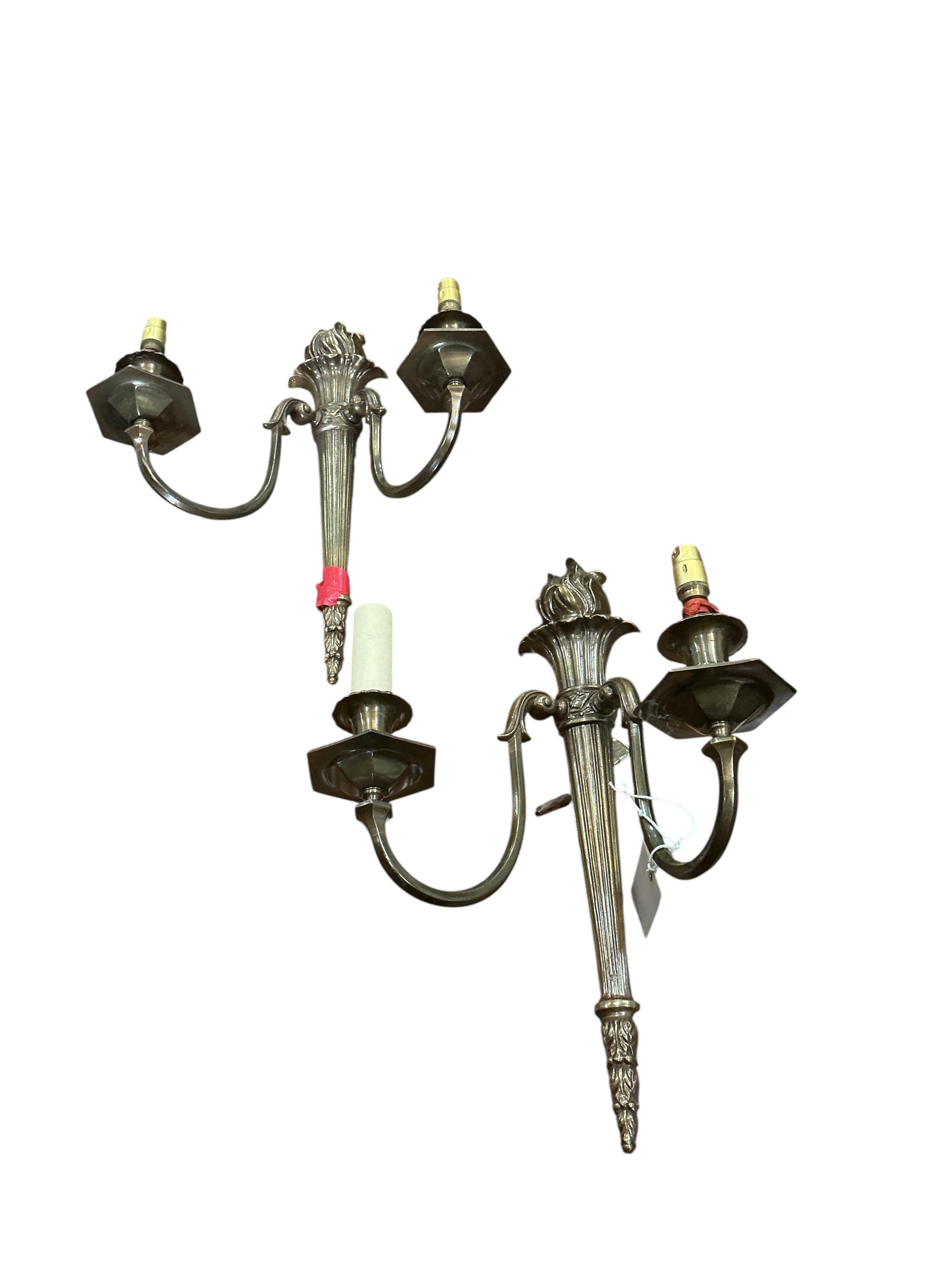 A set of four gilt metal twin branch wall lights with flambé finials and shades, height 41cm